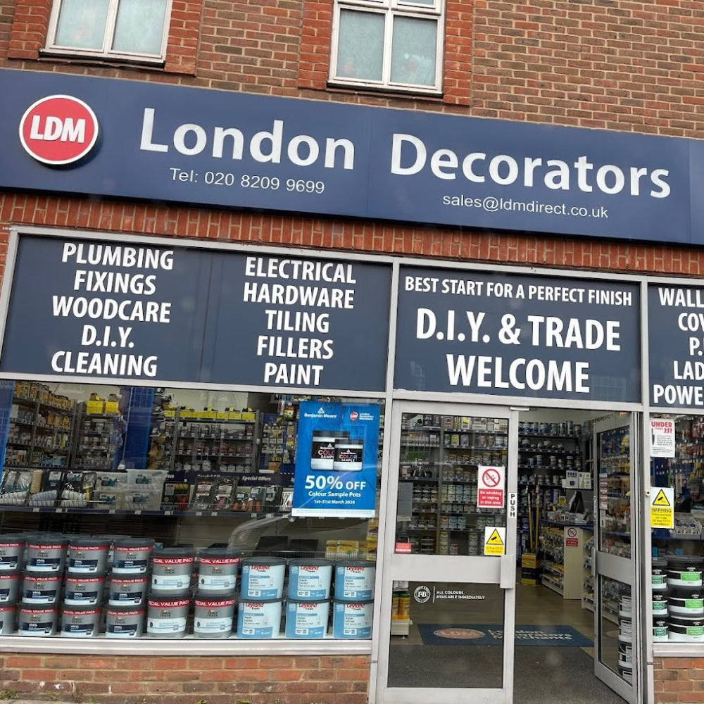 Storefront of London Decorators Merchants Finchley branch with product display and promotional signs.
