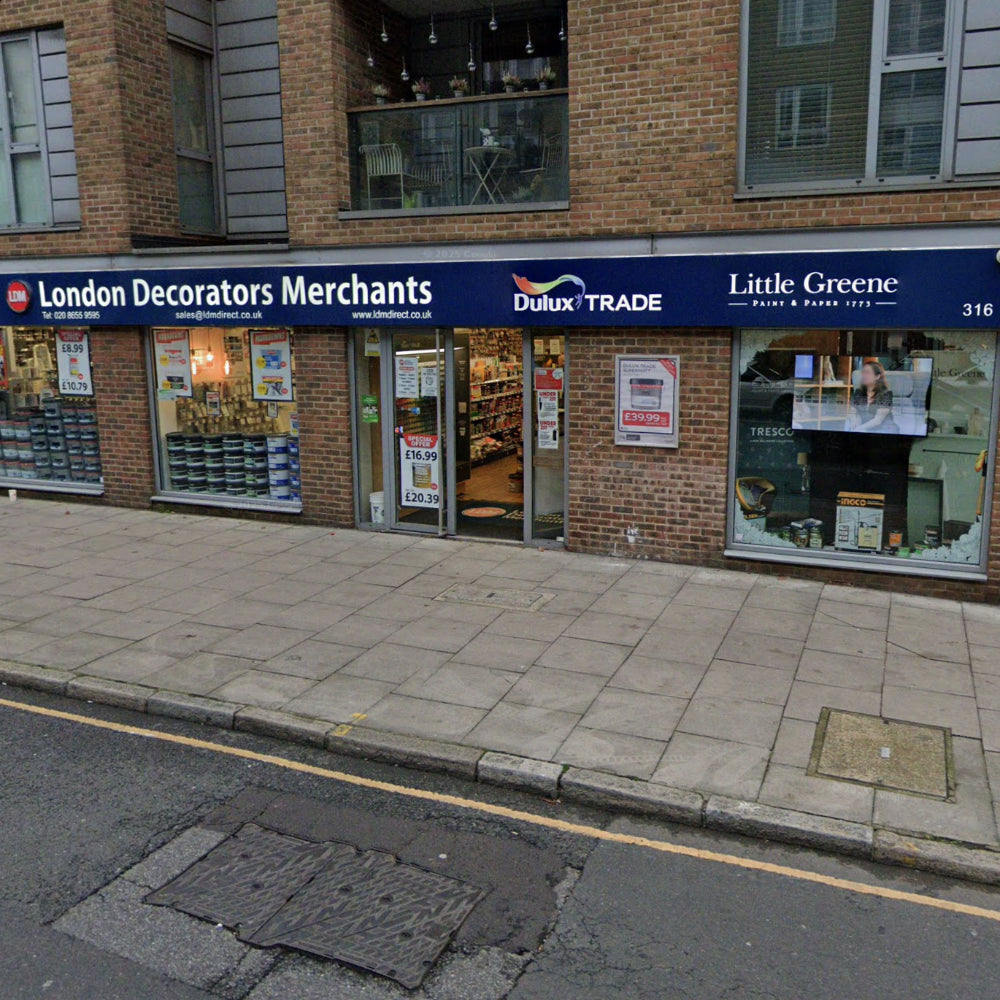 Storefront of London Decorators Merchants Islington Branch with visible brand logos on a brick building.