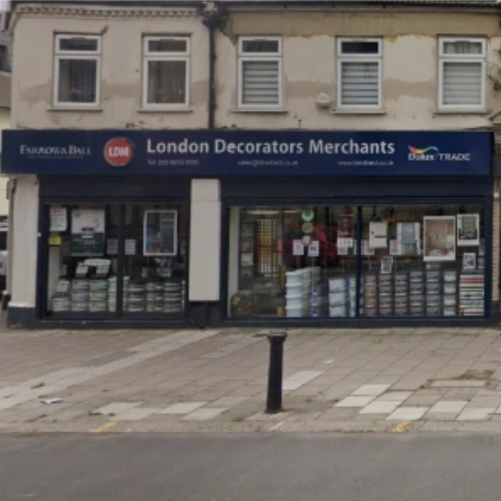 Storefront of London Decorators Merchants Kingston with a blue sign above the entrance.