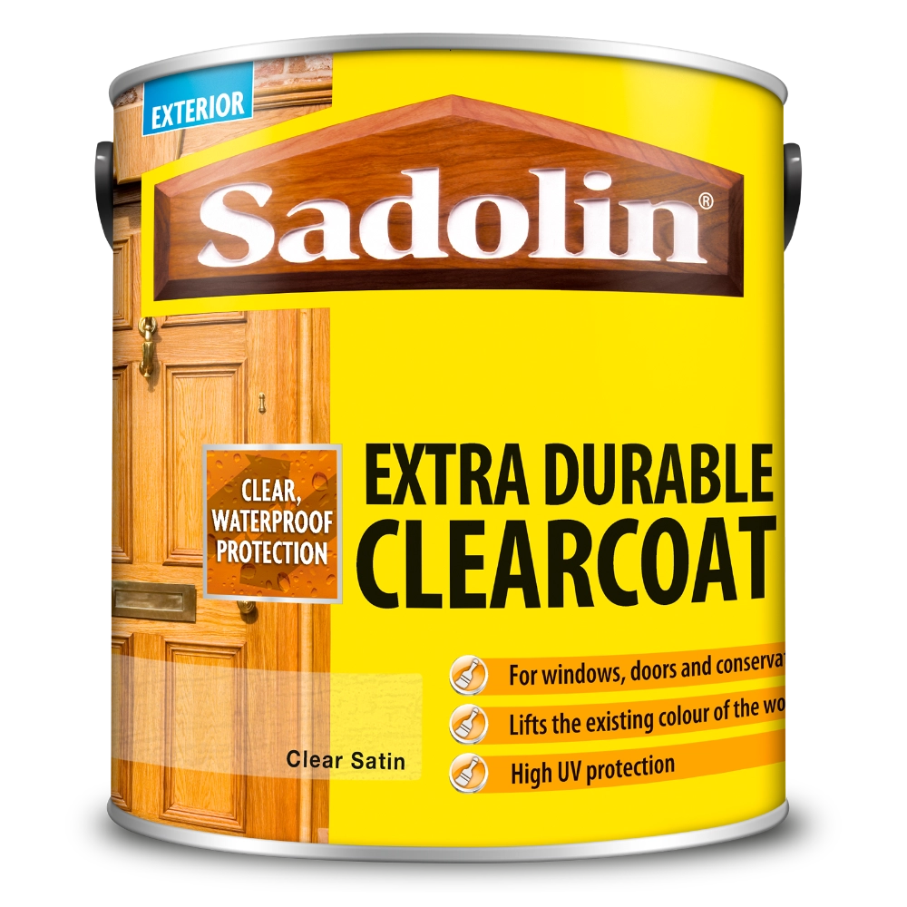 Can of Sadolin Extra Durable Clearcoat with wooden door images on a yellow background