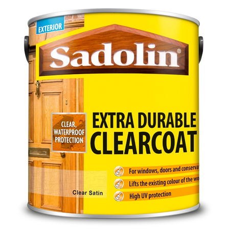 Can of Sadolin Extra Durable Clearcoat with wooden door images on a yellow background