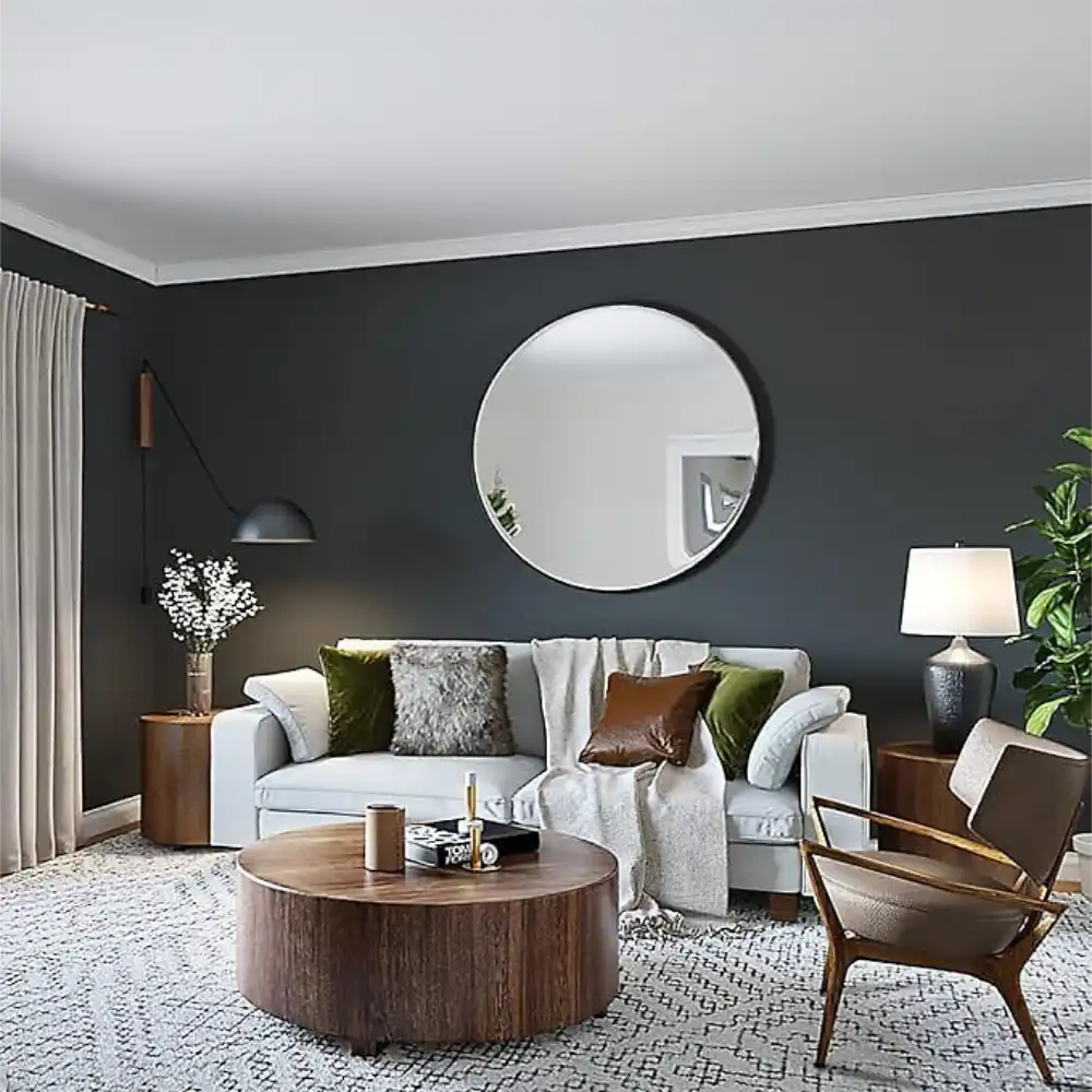 Ultra-matt ceiling finish achieved with Tikkurila Anti-Reflex 2 White showing no flashing or roller marks in a Modern living room with a round mirror, sofa, coffee table, and chair.