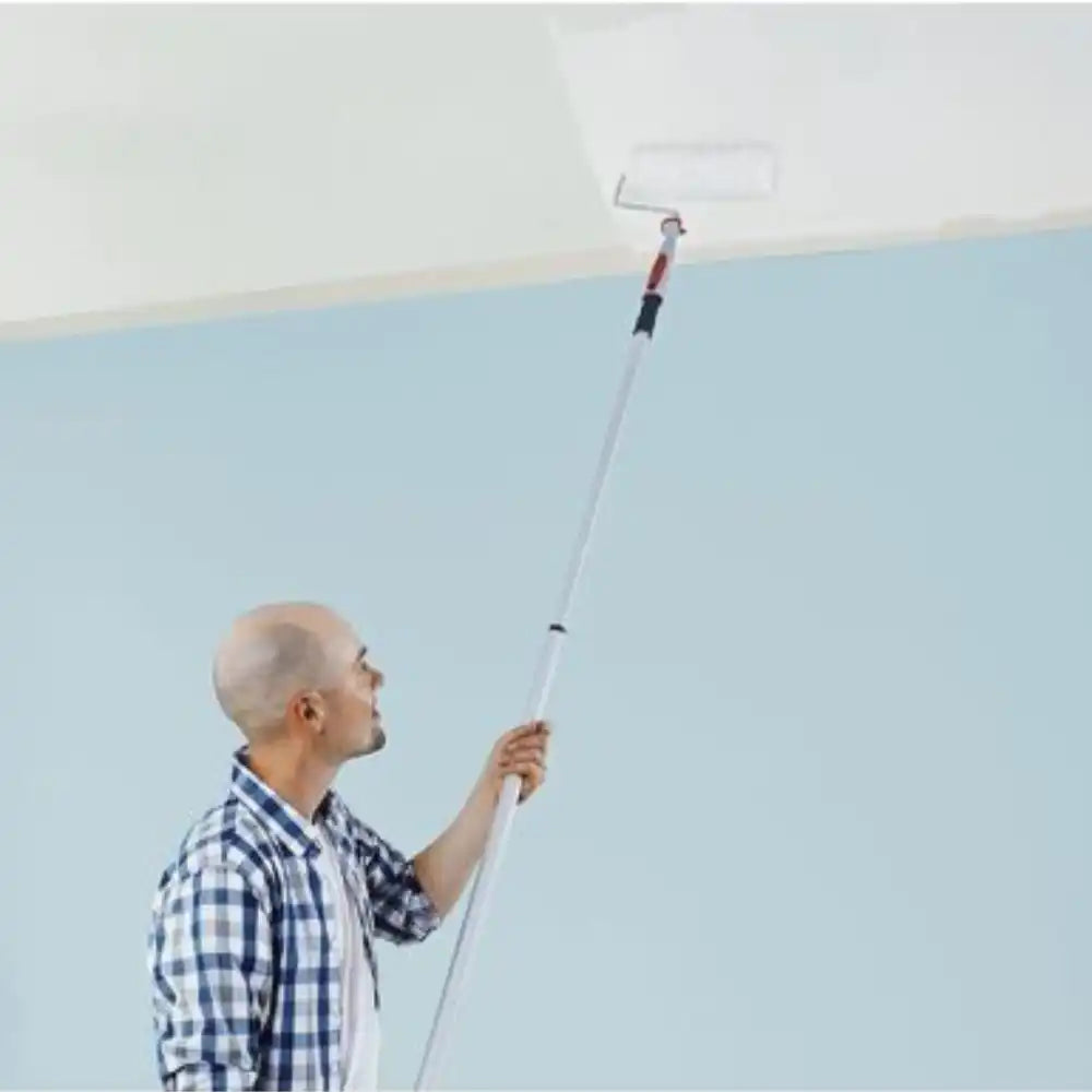 Applying Tikkurila Anti-Reflex 2 to a ceiling with a medium-pile roller for a smooth, even finish.